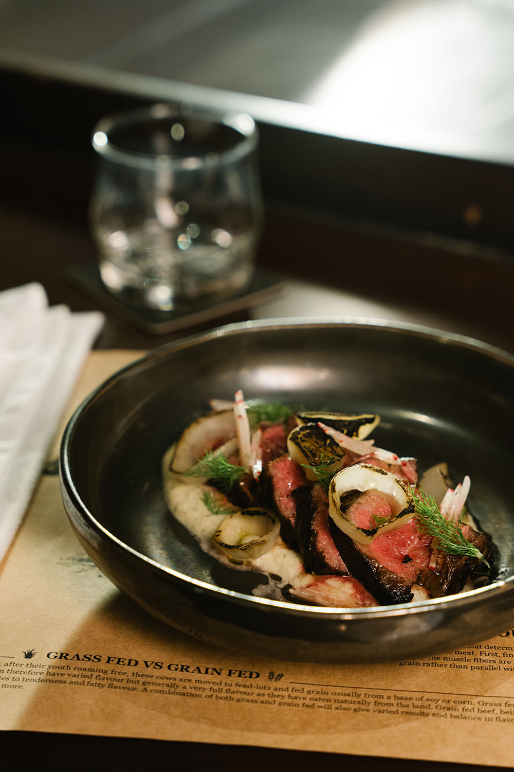 SAKE WASHED WAGYU TRITIP, BLACKENED ONIONS & RADISHES